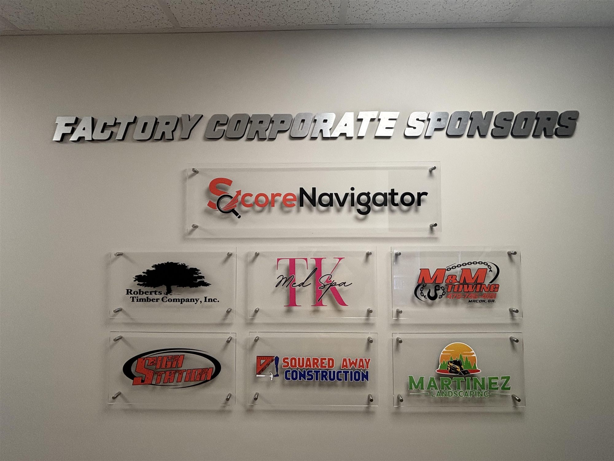 The Factory Corporate Sponsors plaque wall inside the facility